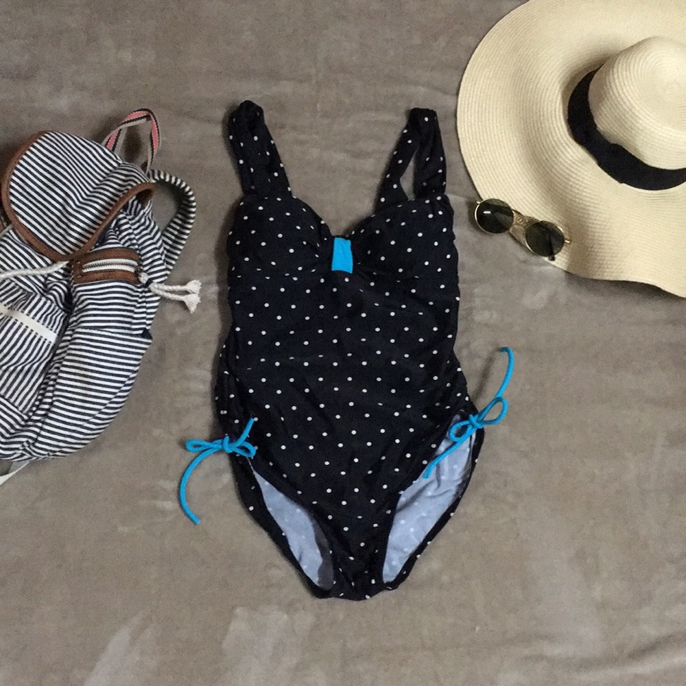 Polka dotted swimsuit with tiffany blue accent.